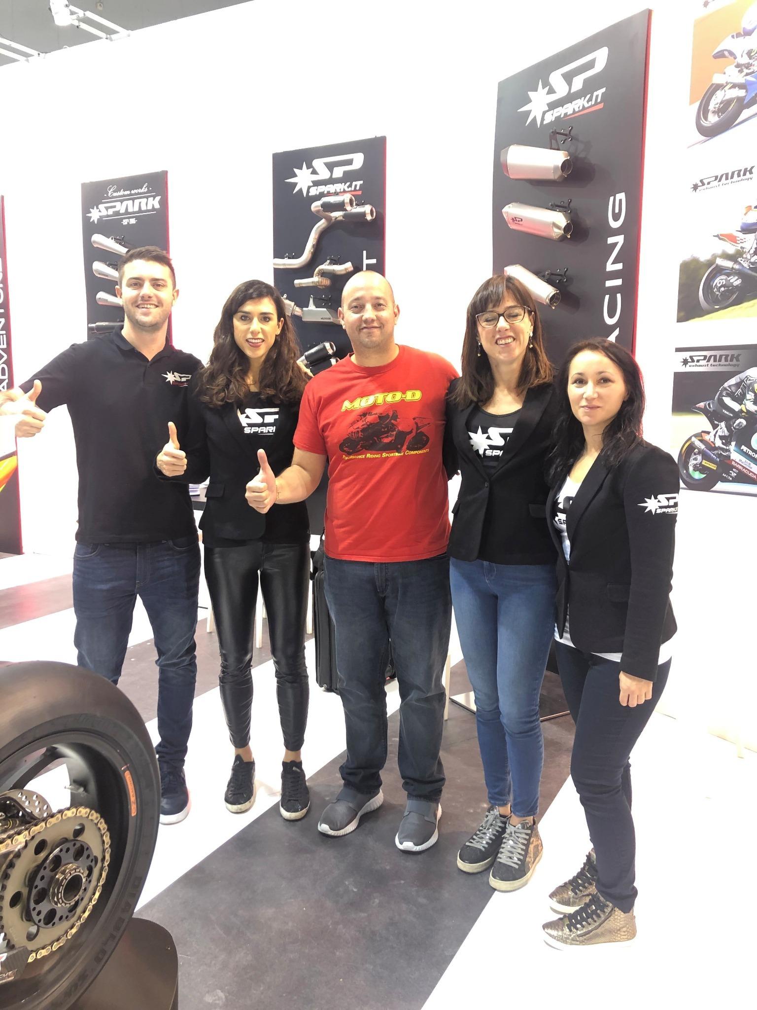 MOTO-D Racing and Spark representatives at the Spark exhibition display